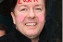Unfunny, Crass, Disrespectful, Atheist Coward, Ricky Gervais -- a transexual look-alike.